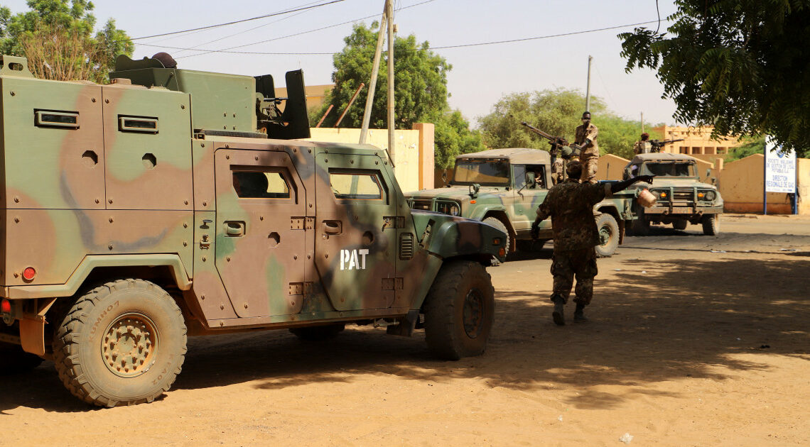 Sodliers set up security perimeter for Ibrahim Boubacar Keita, the President of Mali, in Gao, Mali, on November 7, 2019. (Photo by Souleymane AG ANARA / AFP)